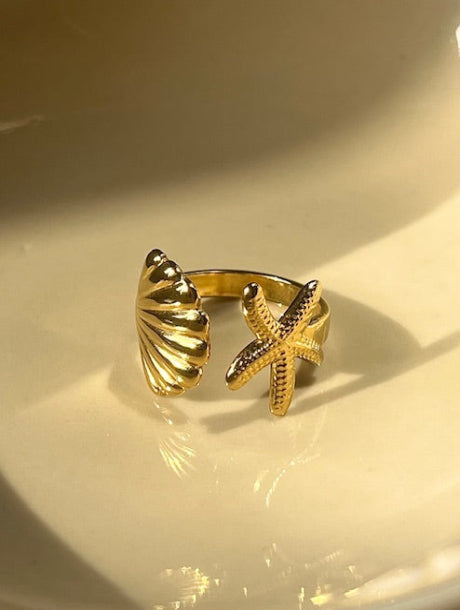 Guld ring i rustfrit stål med blank finish, Sommerring, Musling, Stjerne 
Vandfast og holdbar, Chunky statement ring i guld look – vandfast design, Minimalistisk guldring i rustfrit stål, perfekt til hverdagsbrug
Stacket guld ringe til sommerlook – slidstærk kvalitet. Bæredygtig guldring i stål – skinneeffekt og moderne udtryk.